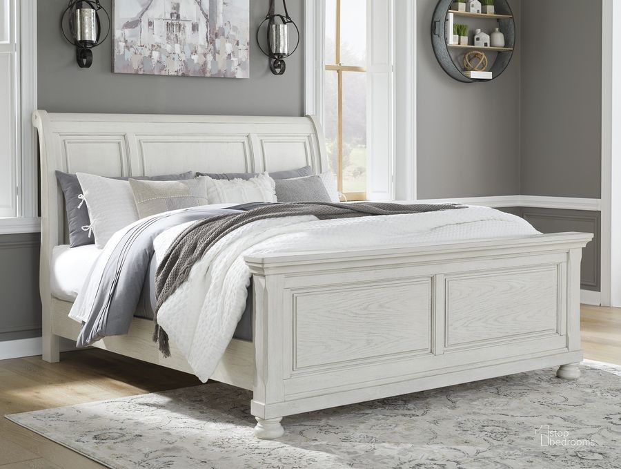 The appearance of Robbinsdale King Sleigh Bed In Antique White designed by Signature Design by Ashley in the transitional interior design. This antique white piece of furniture  was selected by 1StopBedrooms from Robbinsdale Collection to add a touch of cosiness and style into your home. Sku: B742-56;B742-78;B742-97. Bed Type: Sleigh Bed. Material: Wood. Product Type: Sleigh Bed. Bed Size: King. Image1