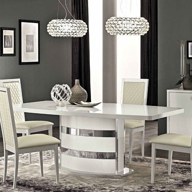 The appearance of Roma Dining Table (White) designed by ESF in the modern / contemporary interior design. This white piece of furniture  was selected by 1StopBedrooms from Roma Collection to add a touch of cosiness and style into your home. Sku: ROMATABLEWHITE. Table Base Style: Pedestal. Product Type: Dining Table. Material: MDF. Table Top Shape: Rectangular. Size: 79.