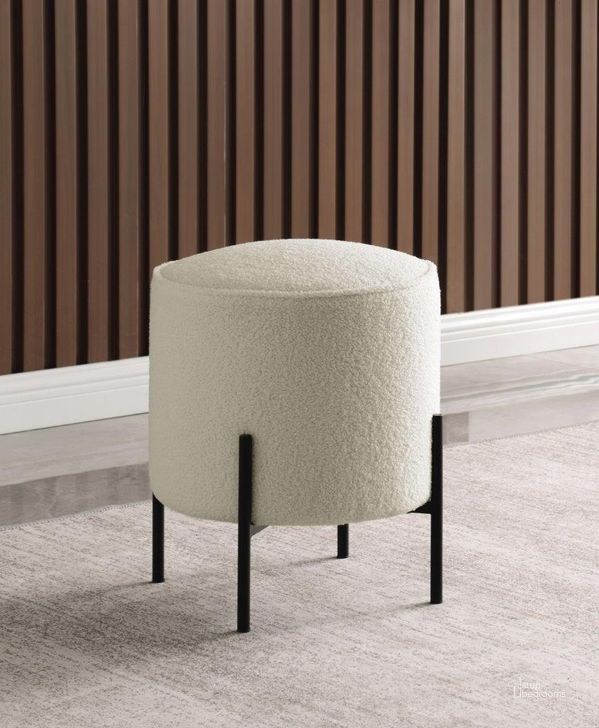 The appearance of Round Upholstered Ottoman In Beige And Matte Black designed by Coaster in the modern / contemporary interior design. This beige piece of furniture  was selected by 1StopBedrooms from  to add a touch of cosiness and style into your home. Sku: 905495. Material: Other. Product Type: Ottoman. Image1