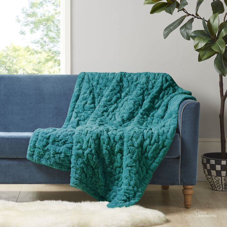 The appearance of Ruched Fur Polyester Solid Brushed Long Fur Knitted Throw In Teal designed by Olliix in the transitional interior design. This teal piece of furniture  was selected by 1StopBedrooms from Ruched Fur Collection to add a touch of cosiness and style into your home. Sku: MP50-3093. Material: Polyester. Product Type: Throw. Image1