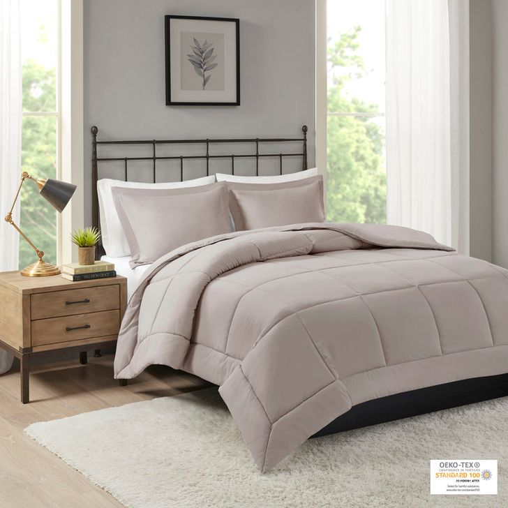 The appearance of Sarasota Polyester Microcell Down Alternative King Comforter Mini Set With 3M Moisture Treatement In Taupe designed by Olliix in the transitional interior design. This taupe piece of furniture  was selected by 1StopBedrooms from Sarasota Collection to add a touch of cosiness and style into your home. Sku: MP10-1260. Bed Size: King. Product Type: Comforter Set. Image1