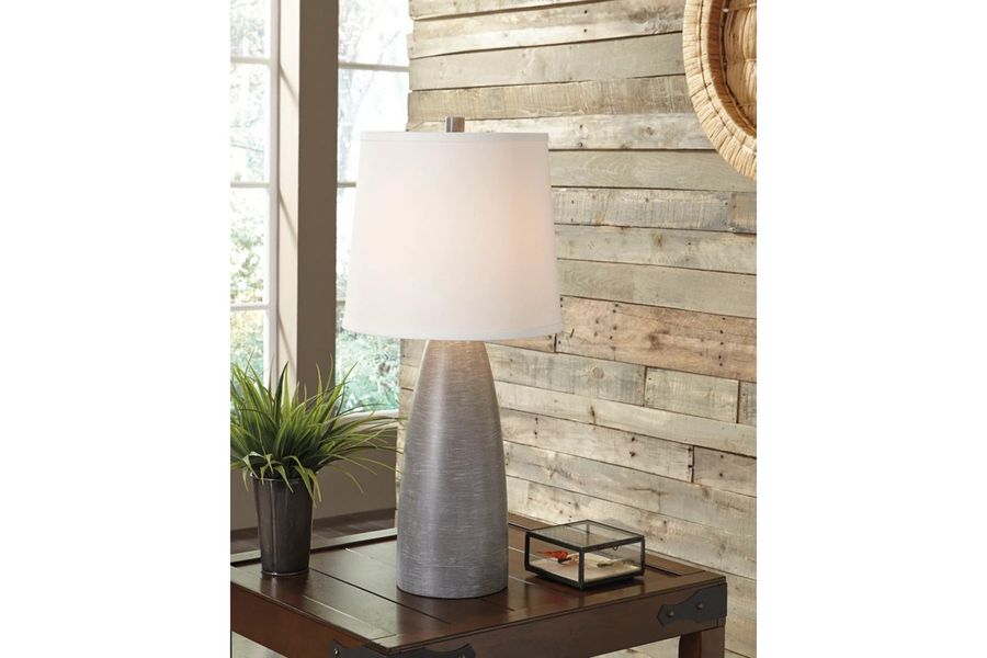 The appearance of Shavontae Gray Poly Table Lamp Set Of 2 designed by Signature Design by Ashley in the modern / contemporary interior design. This gray piece of furniture  was selected by 1StopBedrooms from Shavontae Collection to add a touch of cosiness and style into your home. Sku: L243004. Material: Resin. Product Type: Table Lamp. Image1