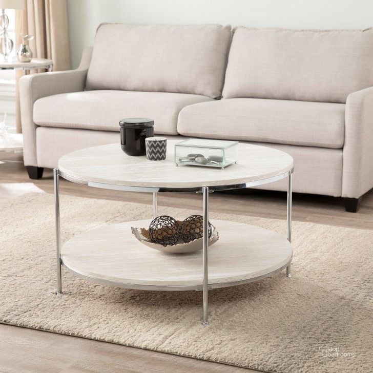 The appearance of Silas Round Faux Stone Cocktail Table In Chrome designed by SEI Furniture in the transitional interior design. This chrome piece of furniture  was selected by 1StopBedrooms from Silas Collection to add a touch of cosiness and style into your home. Sku: CK5740. Material: Wood. Product Type: Cocktail Table. Image1