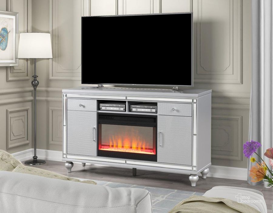 The appearance of Sterling Solid Wood Tv Stand With Electric Fireplace In Silver designed by Galaxy Home Furnishings in the modern / contemporary interior design. This silver piece of furniture  was selected by 1StopBedrooms from Sterling Collection to add a touch of cosiness and style into your home. Sku: 698781148020. Material: Wood. Product Type: TV Stand. Image1