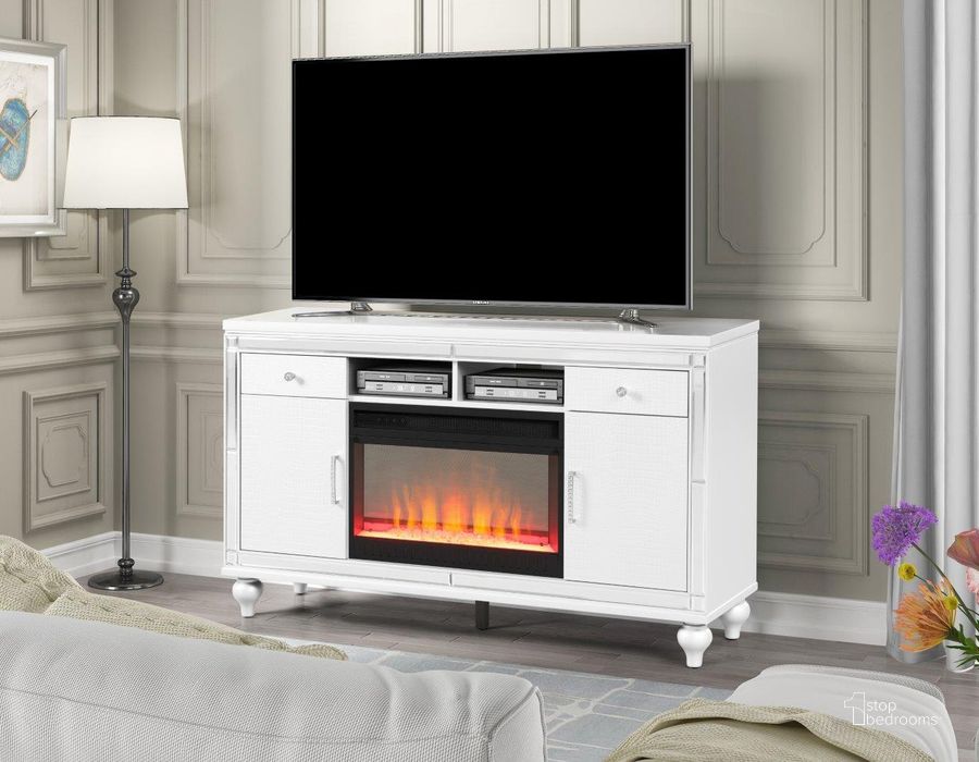 The appearance of Sterling Solid Wood Tv Stand With Electric Fireplace In White designed by Galaxy Home Furnishings in the modern / contemporary interior design. This white piece of furniture  was selected by 1StopBedrooms from Sterling Collection to add a touch of cosiness and style into your home. Sku: 698781106938. Material: Wood. Product Type: TV Stand. Image1