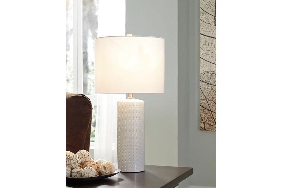 The appearance of Steuben White Ceramic Table Lamp Set of 2 designed by Signature Design by Ashley in the modern / contemporary interior design. This white piece of furniture  was selected by 1StopBedrooms from Steuben Collection to add a touch of cosiness and style into your home. Sku: L177904. Material: Ceramic. Product Type: Table Lamp. Image1
