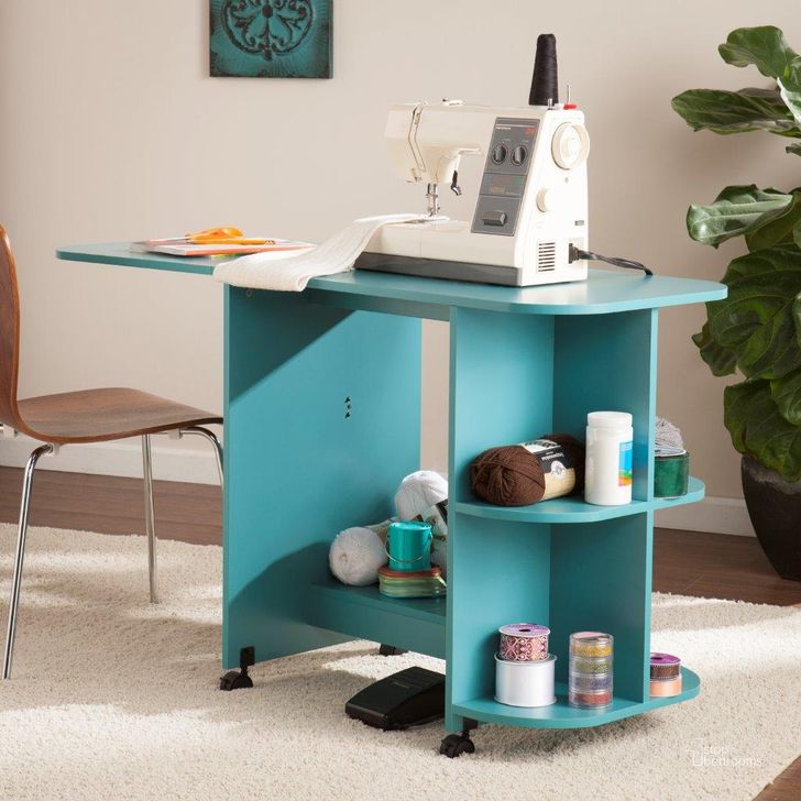 The appearance of Stradville Expandable Rolling Sewing Table Or Craft Station In Turquoise designed by SEI Furniture in the transitional interior design. This turquoise piece of furniture  was selected by 1StopBedrooms from Stradville Collection to add a touch of cosiness and style into your home. Sku: HZ8665. Material: Wood. Product Type: Table. Image1