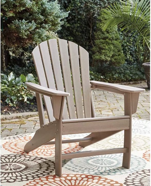 The appearance of Sundown Treasure Grayish Brown Outdoor Adirondack Chair designed by Signature Design by Ashley in the modern / contemporary interior design. This driftwood piece of furniture  was selected by 1StopBedrooms from Sundown Treasure Collection to add a touch of cosiness and style into your home. Sku: P014-898. Material: Wood. Product Type: Outdoor Chair. Image1