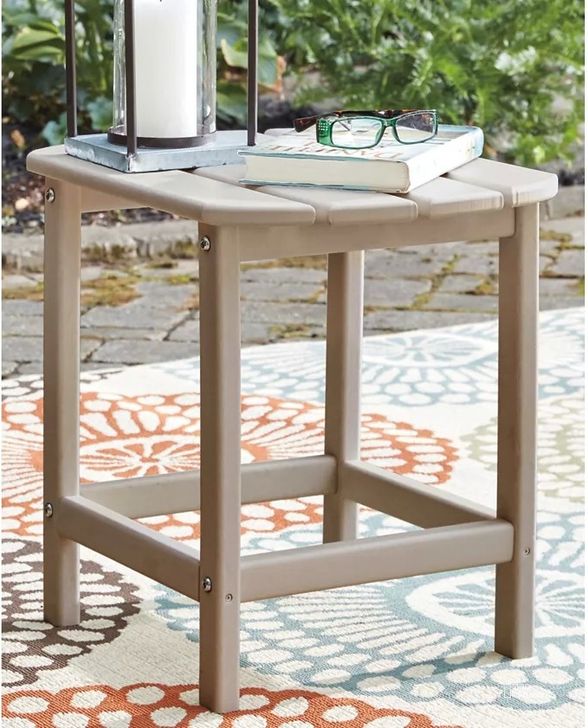 The appearance of Sundown Treasure Grayish Brown Outdoor Rectangular End Table designed by Signature Design by Ashley in the modern / contemporary interior design. This driftwood piece of furniture  was selected by 1StopBedrooms from Sundown Treasure Collection to add a touch of cosiness and style into your home. Sku: P014-703. Material: Wood. Product Type: Outdoor Table. Image1