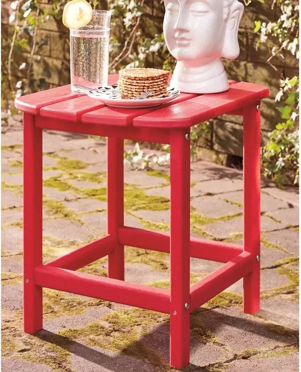The appearance of Sundown Treasure Red Outdoor Rectangular End Table designed by Signature Design by Ashley in the modern / contemporary interior design. This red piece of furniture  was selected by 1StopBedrooms from Sundown Treasure Collection to add a touch of cosiness and style into your home. Sku: P013-703. Material: Wood. Product Type: Outdoor Table. Image1