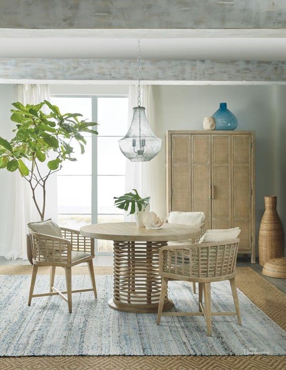 The appearance of Surfrider Light Natural Rattan 48Inch Round Dining Room Set designed by Hooker in the transitional interior design. This beige piece of furniture  was selected by 1StopBedrooms from Surfrider Collection to add a touch of cosiness and style into your home. Sku: 6015-75203-80;6015-75600-80. Table Base Style: Pedestal. Table Top Shape: Round. Material: Wood. Product Type: Dining Room Set. Image1