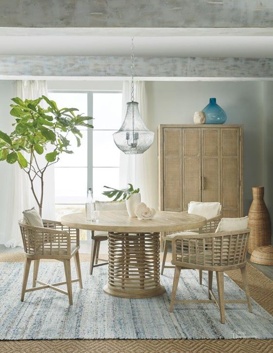 The appearance of Surfrider Light Natural Rattan 60Inch Round Dining Room Set designed by Hooker in the transitional interior design. This beige piece of furniture  was selected by 1StopBedrooms from Surfrider Collection to add a touch of cosiness and style into your home. Sku: 6015-75213-80;6015-75600-80. Table Base Style: Pedestal. Table Top Shape: Round. Material: Wood. Product Type: Dining Room Set. Size: 60". Image1