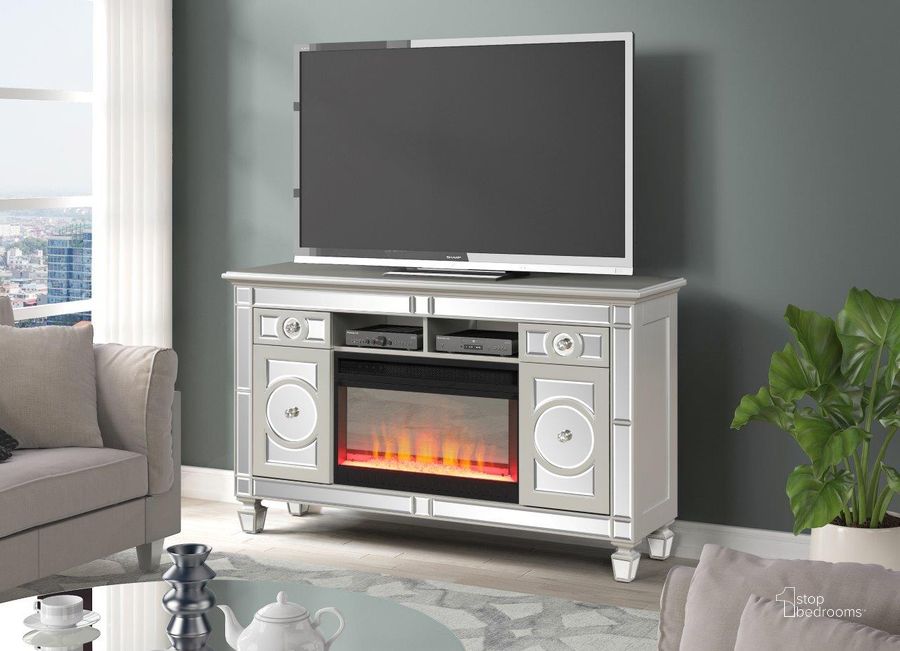 The appearance of Symphony Solid Wood Tv Stand With Electric Fireplace In Silver designed by Galaxy Home Furnishings in the modern / contemporary interior design. This silver piece of furniture  was selected by 1StopBedrooms from Symphony Collection to add a touch of cosiness and style into your home. Sku: 698781420249. Material: Wood. Product Type: TV Stand. Image1