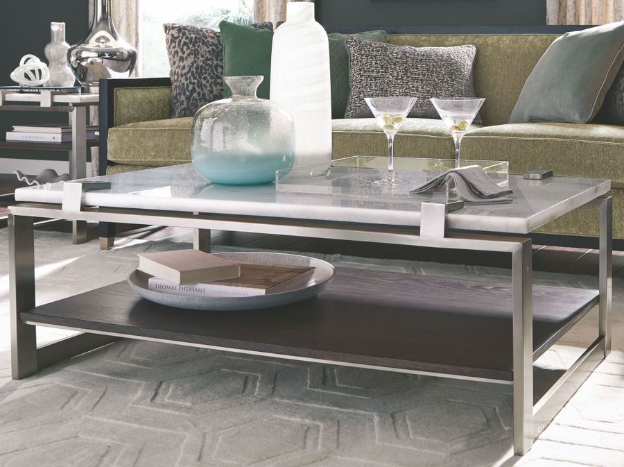 The appearance of Paradox Pearl White Roasted Almond Metal Rectangular Cocktail Table designed by Magnussen in the modern / contemporary interior design. This white piece of furniture  was selected by 1StopBedrooms from Paradox Collection to add a touch of cosiness and style into your home. Sku: T4852-43. Product Type: Cocktail Table. Material: Stone. Image1
