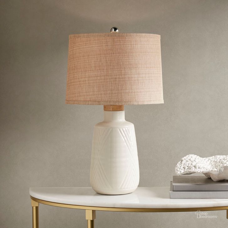 The appearance of Tate Table Lamp In Ivory designed by Olliix in the modern / contemporary interior design. This ivory piece of furniture  was selected by 1StopBedrooms from Tate Collection to add a touch of cosiness and style into your home. Sku: MP153-0001. Material: Polyester. Product Type: Table Lamp. Image1