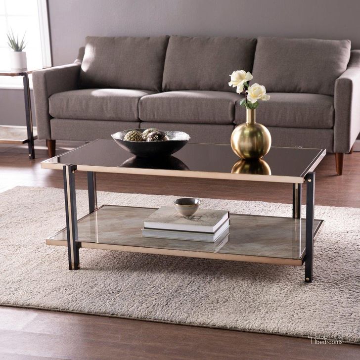 The appearance of Thornsett Cocktail Table With Mirrored Top designed by SEI Furniture in the transitional interior design. This champagne piece of furniture  was selected by 1StopBedrooms from Thornsett Collection to add a touch of cosiness and style into your home. Sku: CK1131200. Material: Wood. Product Type: Cocktail Table. Image1