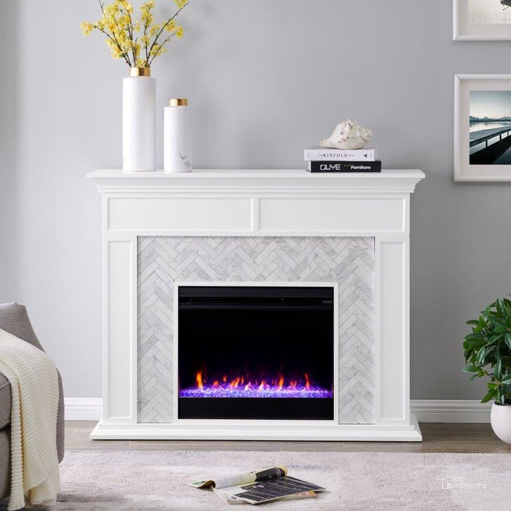 The appearance of Torlington Color Changing Marble Tiled Fireplace designed by SEI Furniture in the modern / contemporary interior design. This white piece of furniture  was selected by 1StopBedrooms from Torlington Collection to add a touch of cosiness and style into your home. Sku: FC1009359. Material: Wood. Product Type: Fireplace. Image1