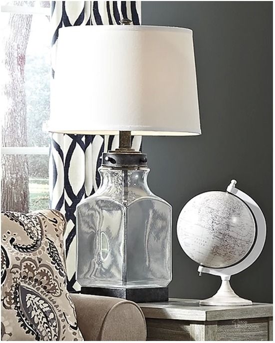 The appearance of Trabzon Transparent/Silver Desk and Buffet Lamp designed by Isaac Tahari in the transitional interior design. This transparent/silver piece of furniture  was selected by 1StopBedrooms from Trabzon Collection to add a touch of cosiness and style into your home. Sku: L430144. Material: Glass. Product Type: Table Lamp. Image1