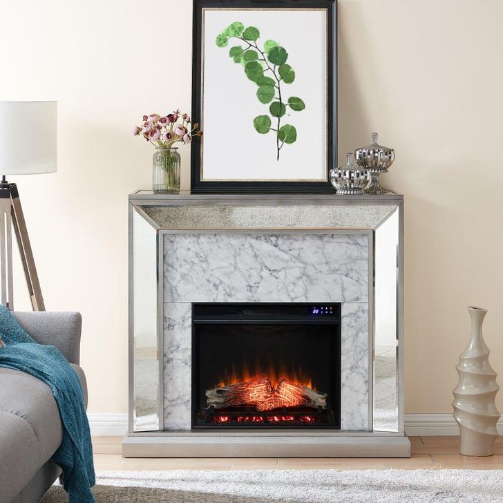 The appearance of Trandling Mirrored Touch Screen Electric Fireplace With Faux Marble designed by SEI Furniture in the transitional interior design. This silver piece of furniture  was selected by 1StopBedrooms from Trandling Collection to add a touch of cosiness and style into your home. Sku: FR1027359. Material: Wood. Product Type: Fireplace. Image1