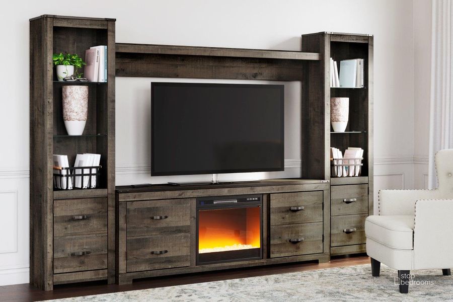 The appearance of Trinell Brown 4 Piece Entertainment Center With Electric Fireplace designed by Signature Design by Ashley in the transitional interior design. This brown piece of furniture  was selected by 1StopBedrooms from Trinell Collection to add a touch of cosiness and style into your home. Sku: W446-168;W446-127;W446-124;W446-124;W100-02. Material: Wood. Product Type: Entertainment Center. Image1