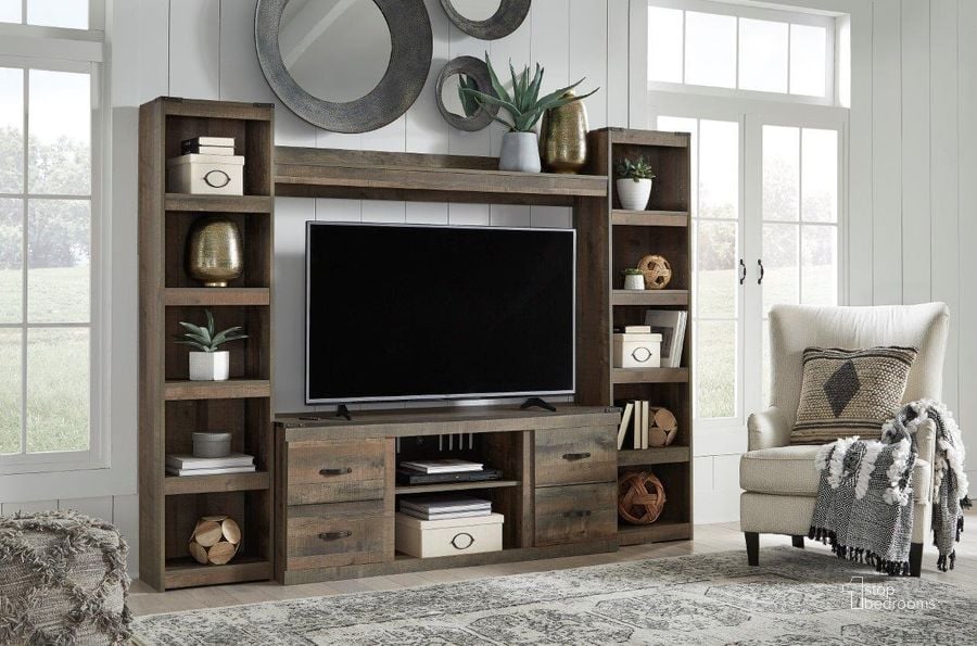 The appearance of Trinell Rustic Brown 4 Piece Entertainment Wall designed by Signature Design by Ashley in the rustic / southwestern interior design. This brown piece of furniture  was selected by 1StopBedrooms from Trinell Collection to add a touch of cosiness and style into your home. Sku: EW0446-268;EW0446-124;EW0446-124;EW0446-127. Material: Wood. Product Type: Entertainment Wall. Image1