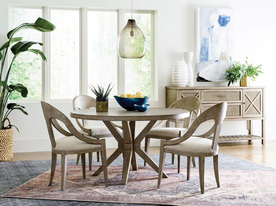 The appearance of West Fork Aged Taupe Hardy Round Dining Room Set designed by American Drew in the transitional interior design. This beige piece of furniture  was selected by 1StopBedrooms from West Fork Collection to add a touch of cosiness and style into your home. Sku: 924-701R;924-638. Table Base Style: Trestle. Table Top Shape: Round. Material: Wood. Product Type: Dining Room Set. Image1