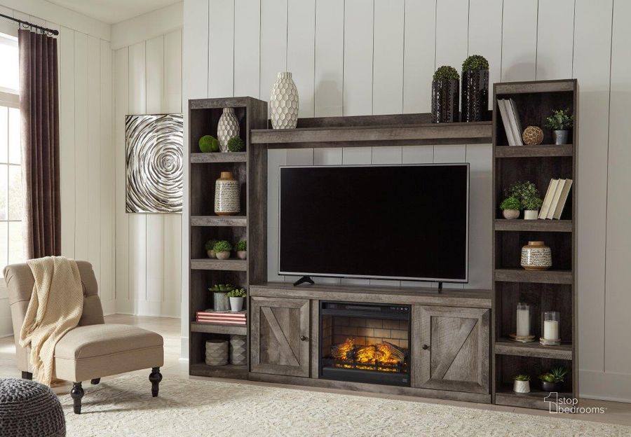 The appearance of Wynnlow Gray Entertainment Wall with Electric Fireplace designed by Signature Design by Ashley in the transitional interior design. This gray piece of furniture  was selected by 1StopBedrooms from Wynnlow Collection to add a touch of cosiness and style into your home. Sku: EW0440-268;EW0440-124;EW0440-124;EW0440-127;W100-101. Material: Wood. Product Type: Entertainment Wall. Image1