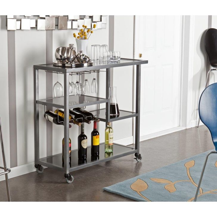 The appearance of Zephs Bar Cart designed by SEI Furniture in the modern / contemporary interior design. This grey piece of furniture  was selected by 1StopBedrooms from Zephs Collection to add a touch of cosiness and style into your home. Sku: HZ8810. Product Type: Bar Cart. Material: Iron. Image1