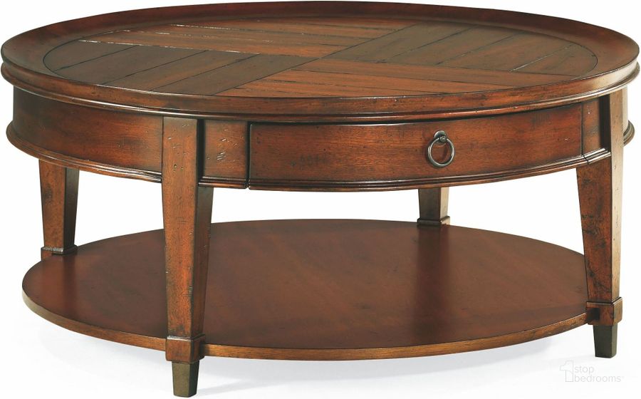 The appearance of Sunset Valley Rich Mahogany Round Cocktail Table designed by Hammary in the transitional interior design. This brown piece of furniture  was selected by 1StopBedrooms from Sunset Valley Collection to add a touch of cosiness and style into your home. Sku: 197-911. Table Top Shape: Round. Material: Wood. Product Type: Cocktail Table. Image1