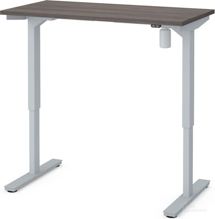 The appearance of Bestar 24" X 48" Electric Height Adjustable Table In Bark Gray designed by Bestar in the modern / contemporary interior design. This bark gray piece of furniture  was selected by 1StopBedrooms from Bestar Collection to add a touch of cosiness and style into your home. Sku: 65837-47. Material: Wood. Product Type: Adjustable Table. Image1