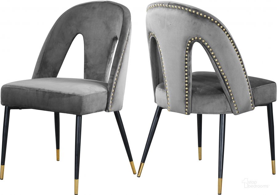 The appearance of Meridian Akoya Grey Velvet Dining Chair Set of 2 designed by Meridian in the modern / contemporary interior design. This grey velvet piece of furniture  was selected by 1StopBedrooms from Akoya Collection to add a touch of cosiness and style into your home. Sku: 794Grey-C. Product Type: Dining Chair. Material: Velvet. Image1