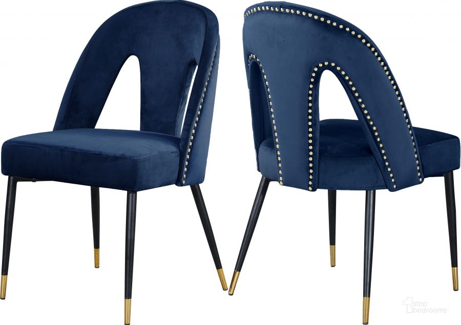 The appearance of Meridian Akoya Navy Velvet Dining Chair Set of 2 designed by Meridian in the modern / contemporary interior design. This navy velvet piece of furniture  was selected by 1StopBedrooms from Akoya Collection to add a touch of cosiness and style into your home. Sku: 794Navy-C. Product Type: Dining Chair. Material: Velvet. Image1