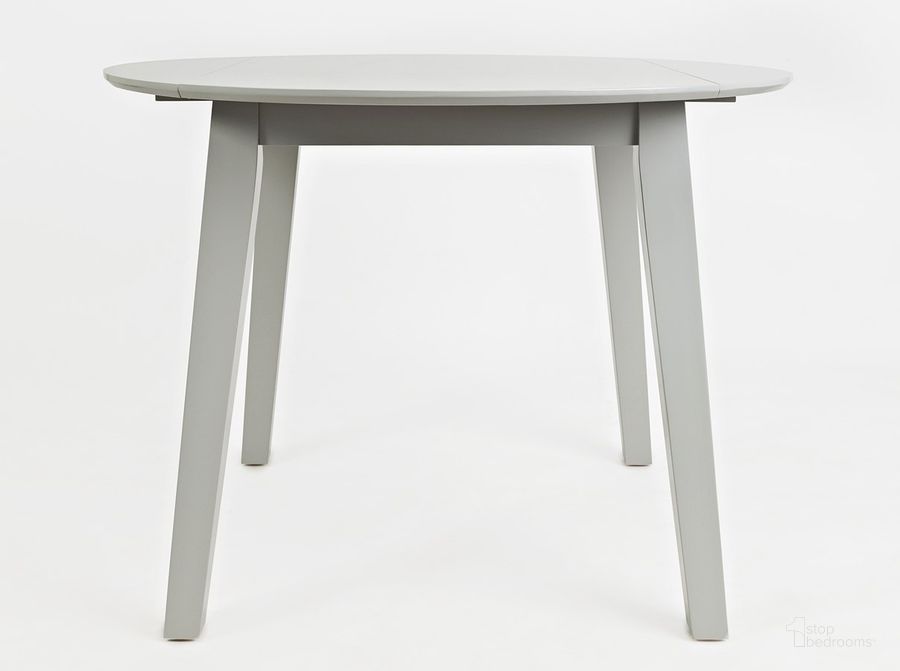 The appearance of Simplicity Round Drop Leaf Table (Dove) designed by Jofran in the transitional interior design. This dove grey piece of furniture  was selected by 1StopBedrooms from Simplicity Collection to add a touch of cosiness and style into your home. Sku: 252-28. Table Base Style: Legs. Table Top Shape: Round. Product Type: Dining Table. Material: Rubberwood. Image1