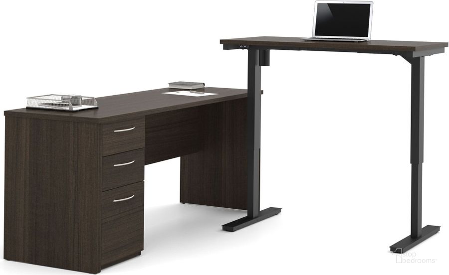 The appearance of Embassy Dark Chocolate L Desk with Electric Adjustable Height Table designed by Bestar in the modern / contemporary interior design. This brown piece of furniture  was selected by 1StopBedrooms from Embassy Collection to add a touch of cosiness and style into your home. Sku: 60885-79. Material: Wood. Product Type: Desk. Image1
