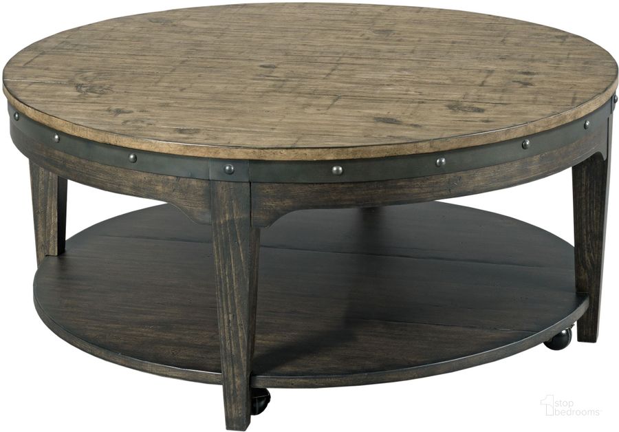 The appearance of Plank Road Charcoal Artisans Round Cocktail Table designed by Kincaid in the modern / contemporary interior design. This brown and gray piece of furniture  was selected by 1StopBedrooms from Plank Road Collection to add a touch of cosiness and style into your home. Sku: 706-911C. Table Top Shape: Round. Material: Wood. Product Type: Cocktail Table. Image1