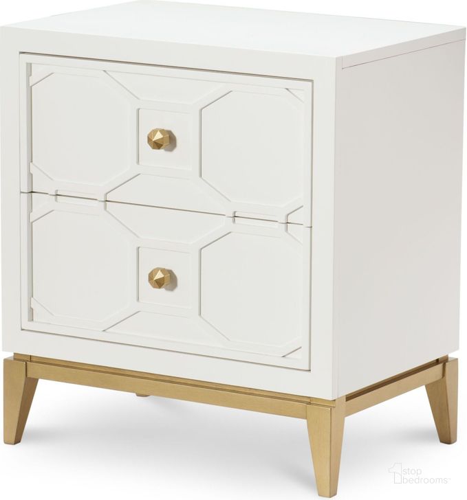 The appearance of Uptown White and Gold Nightstand by Rachael Ray designed by Legacy Classic in the transitional interior design. This white piece of furniture  was selected by 1StopBedrooms from Uptown Collection to add a touch of cosiness and style into your home. Sku: N7810-3101. Material: Wood. Product Type: Nightstand. Image1