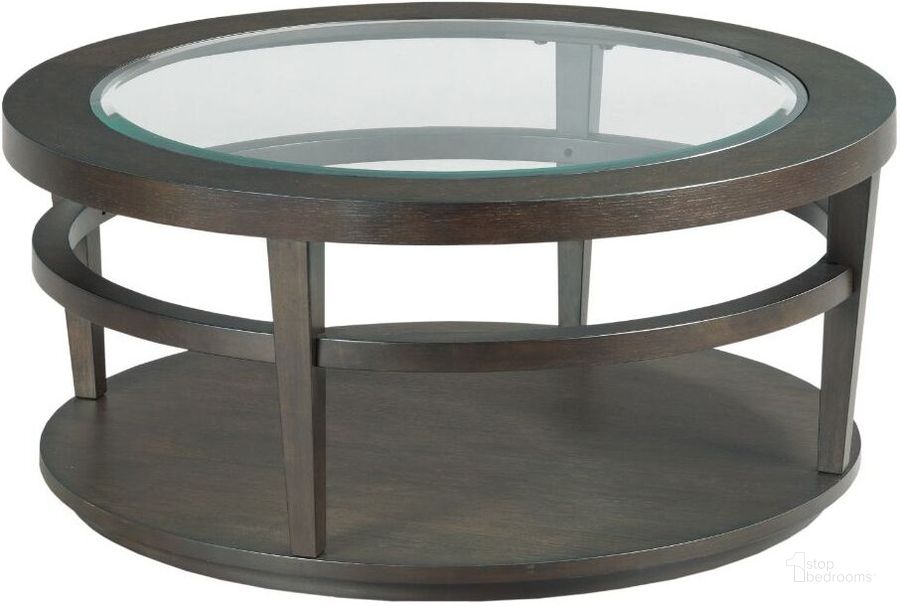 The appearance of Round Cocktail Table designed by Hammary in the transitional interior design. This dark brown piece of furniture  was selected by 1StopBedrooms from Urbana Collection to add a touch of cosiness and style into your home. Sku: 880-911. Material: Wood. Product Type: Cocktail Table.