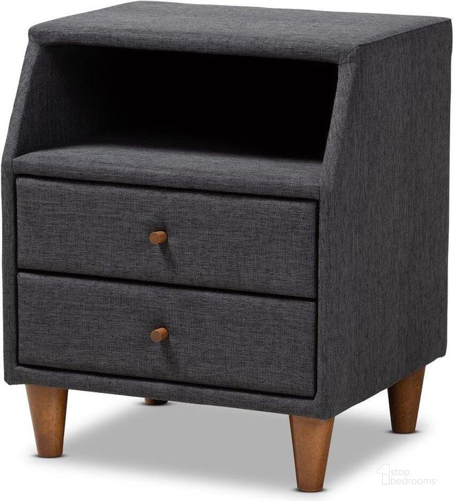 The appearance of Baxton Studio Claverie Mid-Century Modern Charcoal Fabric Upholstered 2-Drawer Wood Nightstand designed by Baxton Studio in the transitional interior design. This charcoal piece of furniture  was selected by 1StopBedrooms from Claverie Collection to add a touch of cosiness and style into your home. Sku: BBT3157-Dark Grey-NS. Product Type: Nightstand. Material: Rubberwood. Image1