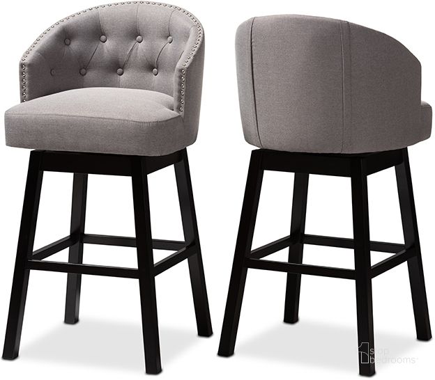 The appearance of Baxton Studio Theron Transitional Gray Fabric Upholstered Wood Swivel Bar Stool Set Of 2 designed by Baxton Studio in the traditional interior design. This gray piece of furniture  was selected by 1StopBedrooms from Theron Collection to add a touch of cosiness and style into your home. Sku: BBT5210B-Grey-BS. Product Type: Barstool. Material: Rubberwood. Image1