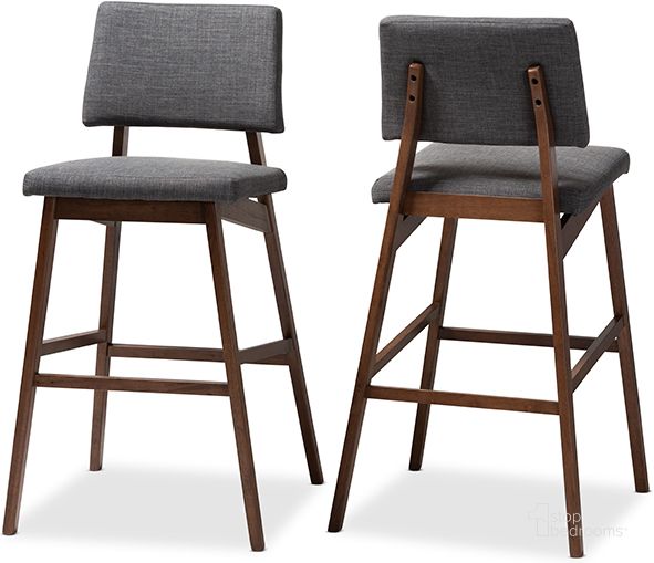 The appearance of Baxton Studio Colton Mid-Century Modern Dark Gray Fabric Upholstered And Walnut-Finished Wood Bar Stool Set Of 2 designed by Baxton Studio in the transitional interior design. This gray piece of furniture  was selected by 1StopBedrooms from Colton Collection to add a touch of cosiness and style into your home. Sku: Colton-Dark Grey-BS. Product Type: Barstool. Material: Rubberwood. Image1