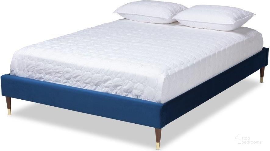 The appearance of Baxton Studio Volden Glam and Luxe Navy Blue Velvet Fabric Upholstered Full Size Wood Platform Bed Frame with Gold-Tone Leg Tips designed by Baxton Studio in the glam interior design. This navy blue piece of furniture  was selected by 1StopBedrooms from Volden Collection to add a touch of cosiness and style into your home. Sku: BBT6598A1-Navy Blue-Full. Product Type: Bed Frame. Material: Rubberwood. Image1