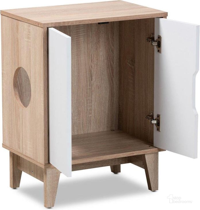 The appearance of Baxton Studio Romy Mid-Century Modern Two-Tone Oak and White Finished 2-Door Wood Cat Litter Box Cover House designed by Baxton Studio in the transitional interior design. This white piece of furniture  was selected by 1StopBedrooms from Romy Collection to add a touch of cosiness and style into your home. Sku: SECHC150011WI-Hana Oak/White-Cat House. Material: MDF. Product Type: Miscellaneous. Image1