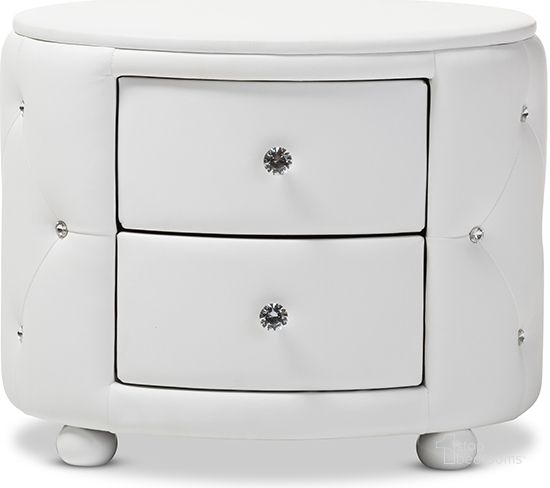 The appearance of Baxton Studio Davina Hollywood Glamour Style Oval 2-Drawer White Faux Leather Upholstered Nightstand designed by Baxton Studio in the glam interior design. This white piece of furniture  was selected by 1StopBedrooms from Davina Collection to add a touch of cosiness and style into your home. Sku: BBT3119-White NS. Product Type: Nightstand. Material: MDF. Image1