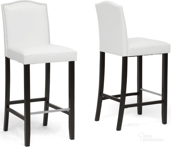 The appearance of Baxton Studio Libra White Modern Bar Stool With Nail Head Trim (Set Of 2) designed by Baxton Studio in the transitional interior design. This white piece of furniture  was selected by 1StopBedrooms from Libra Collection to add a touch of cosiness and style into your home. Sku: BBT5111 Bar Stool-White. Material: Wood. Product Type: Barstool. Image1