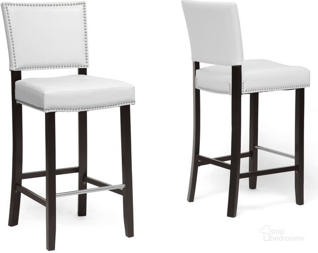 The appearance of Baxton Studio Aries White Modern Bar Stool With Nail Head Trim (Set Of 2) designed by Baxton Studio in the transitional interior design. This white piece of furniture  was selected by 1StopBedrooms from Aries Collection to add a touch of cosiness and style into your home. Sku: BBT5112 Bar Stool-White. Material: Wood. Product Type: Barstool. Image1