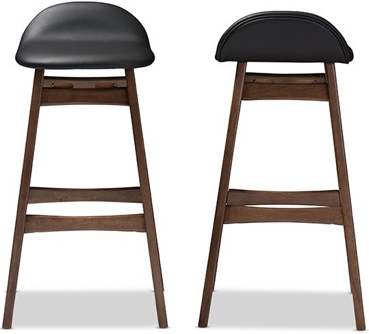 The appearance of Bloom Scandinavian Style Black Faux Leather Upholstered Walnut Wood Finishing 30-Inches Bar Stool (Set Of 2) designed by Baxton Studio in the modern / contemporary interior design. This black piece of furniture  was selected by 1StopBedrooms from Bloom Collection to add a touch of cosiness and style into your home. Sku: Bloom Barstool-Black PVC. Product Type: Barstool. Material: Rubberwood. Image1