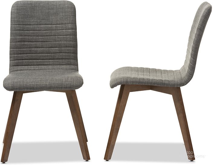 The appearance of Baxton Studio Sugar Mid-Century Retro Modern Scandinavian Style Dark Grey Fabric Upholstered Walnut Wood Finishing Dining Chair (Set Of 2) designed by Baxton Studio in the modern / contemporary interior design. This dark grey piece of furniture  was selected by 1StopBedrooms from Sugar Collection to add a touch of cosiness and style into your home. Sku: Sugar Dining Chair-Dark Grey. Material: Fabric. Product Type: Dining Chair. Image1