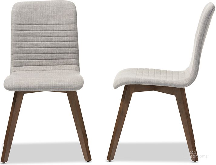 The appearance of Baxton Studio Sugar Mid-Century Retro Modern Scandinavian Style Light Grey Fabric Upholstered Walnut Wood Finishing Dining Chair (Set Of 2) designed by Baxton Studio in the modern / contemporary interior design. This light grey piece of furniture  was selected by 1StopBedrooms from Sugar Collection to add a touch of cosiness and style into your home. Sku: Sugar Dining Chair-Light Grey. Material: Fabric. Product Type: Dining Chair. Image1