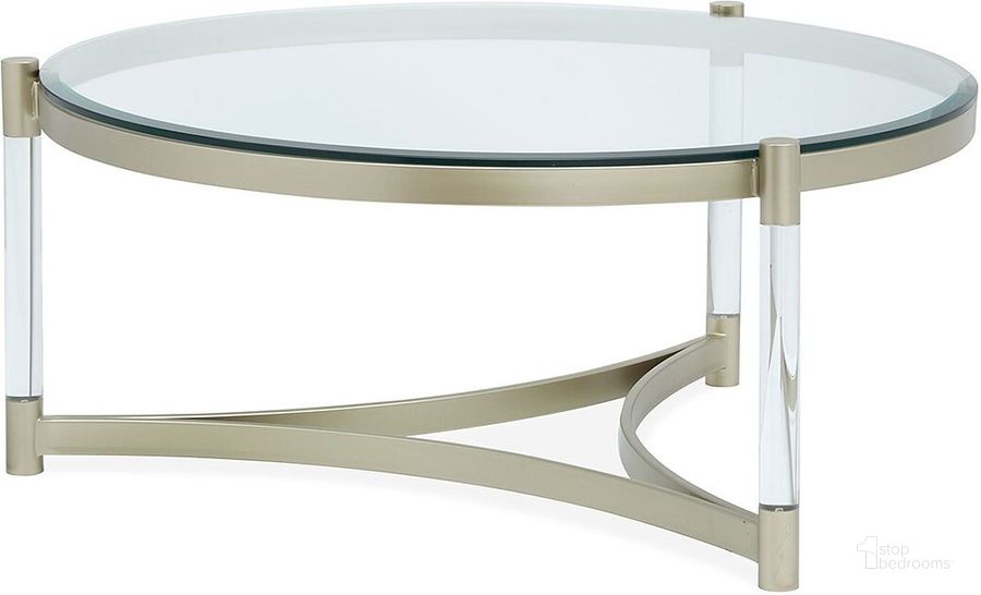 The appearance of Silas Platinum Round Cocktail Table designed by Magnussen in the modern / contemporary interior design. This silver piece of furniture  was selected by 1StopBedrooms from Silas Collection to add a touch of cosiness and style into your home. Sku: T4984-45. Product Type: Cocktail Table. Image1
