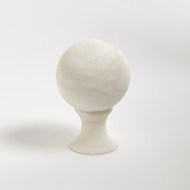 The appearance of Alabaster Small Sphere Stand In White designed by Global Views in the modern / contemporary interior design. This white piece of furniture  was selected by 1StopBedrooms from Alabaster Collection to add a touch of cosiness and style into your home. Sku: 3.31552. Product Type: Decorative Accessory. Material: Alabaster. Image1
